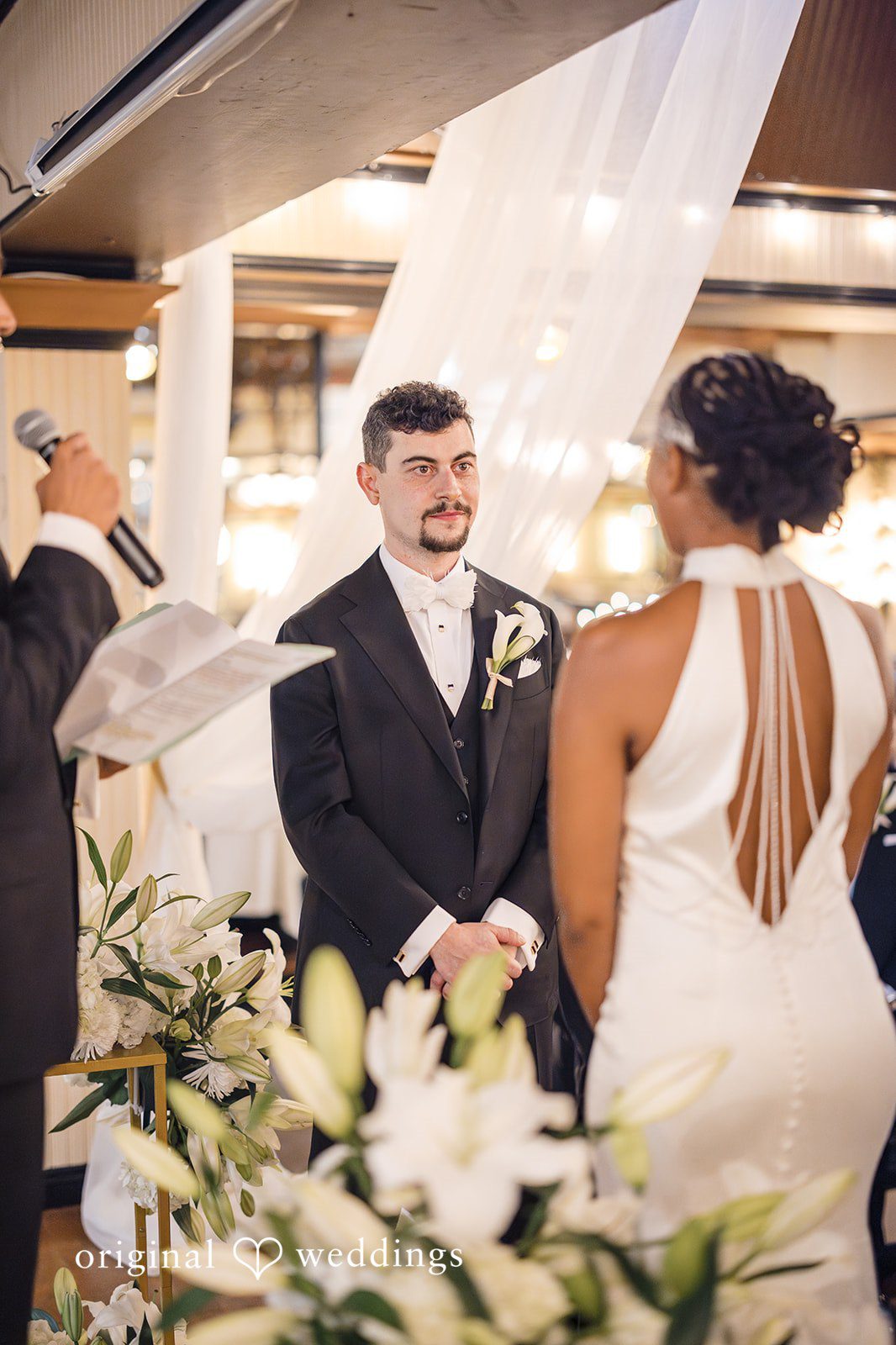 Patrick + Barbara Jean Bride and groom standing together during their wedding ceremony.