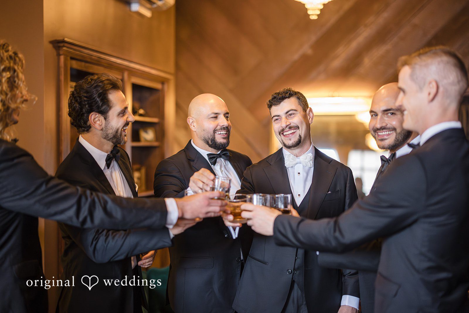 Patrick + Barbara Jean Bride and groom standing close together, smiling and embracing for a portrait.