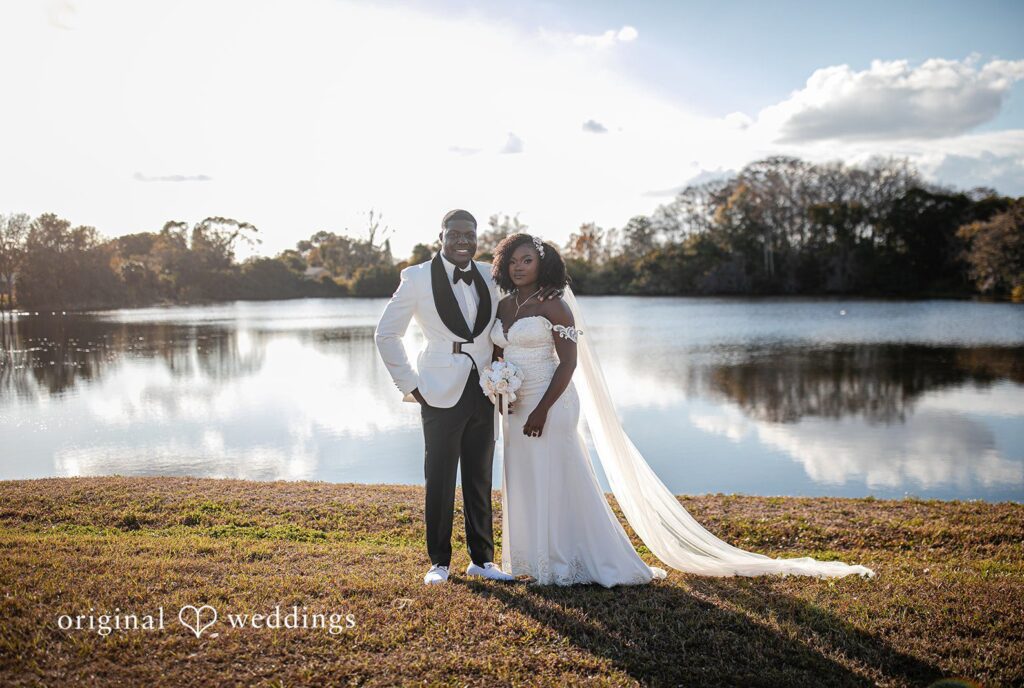 Whitchyna + Kevin Romantic couple picture near water at Imperial Design photographed by Orlando wedding photographers from Original Weddings