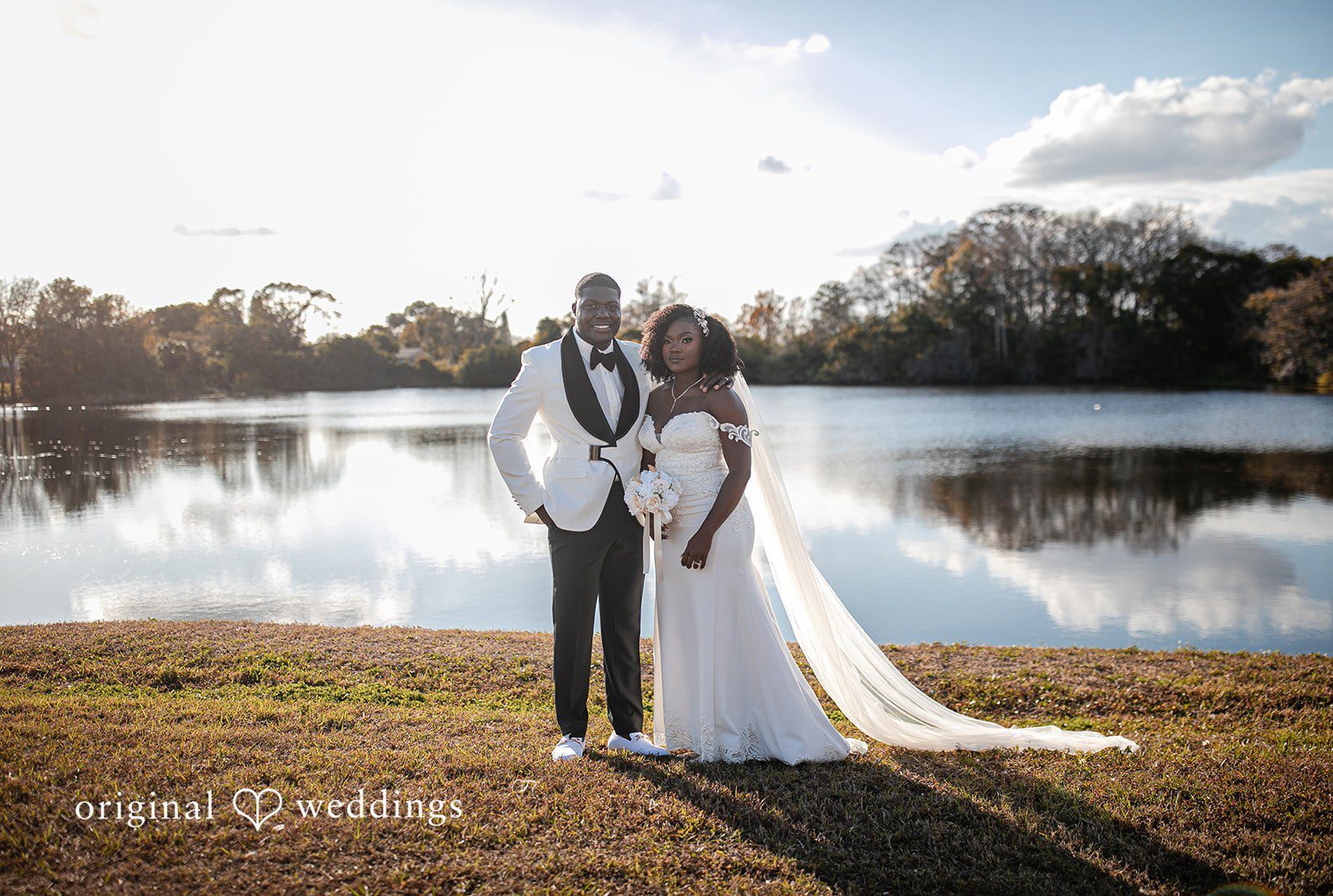 Romantic couple picture near water at Imperial Design photographed by Orlando wedding photographers from Original Weddings