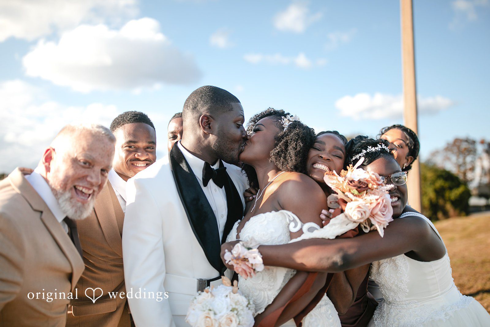Whitchyna + Kevin Bride and groom celebrating marriage with a kiss