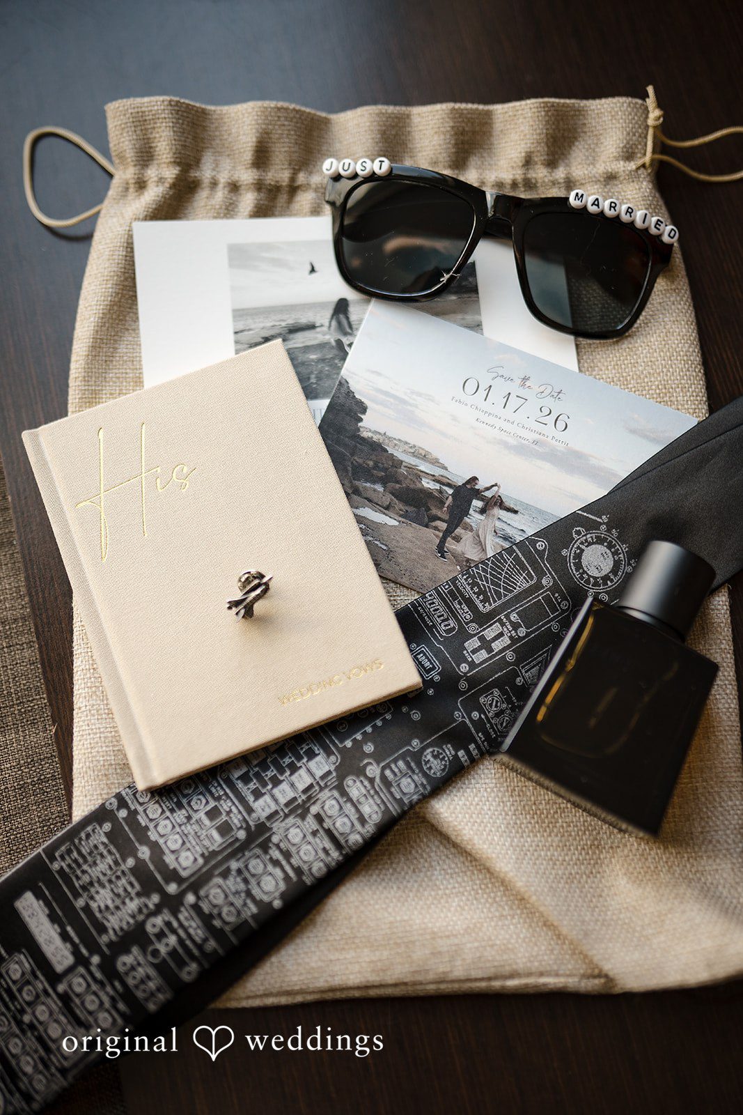 Groom accessories detail with tie, sunglasses and perfume
