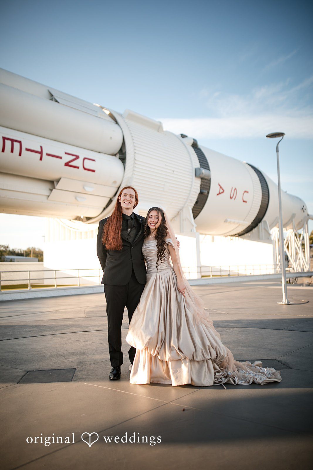 Golden hour couple portrait at Kennedy Space Center photographed by Orlando wedding photographer from Original Weddings
