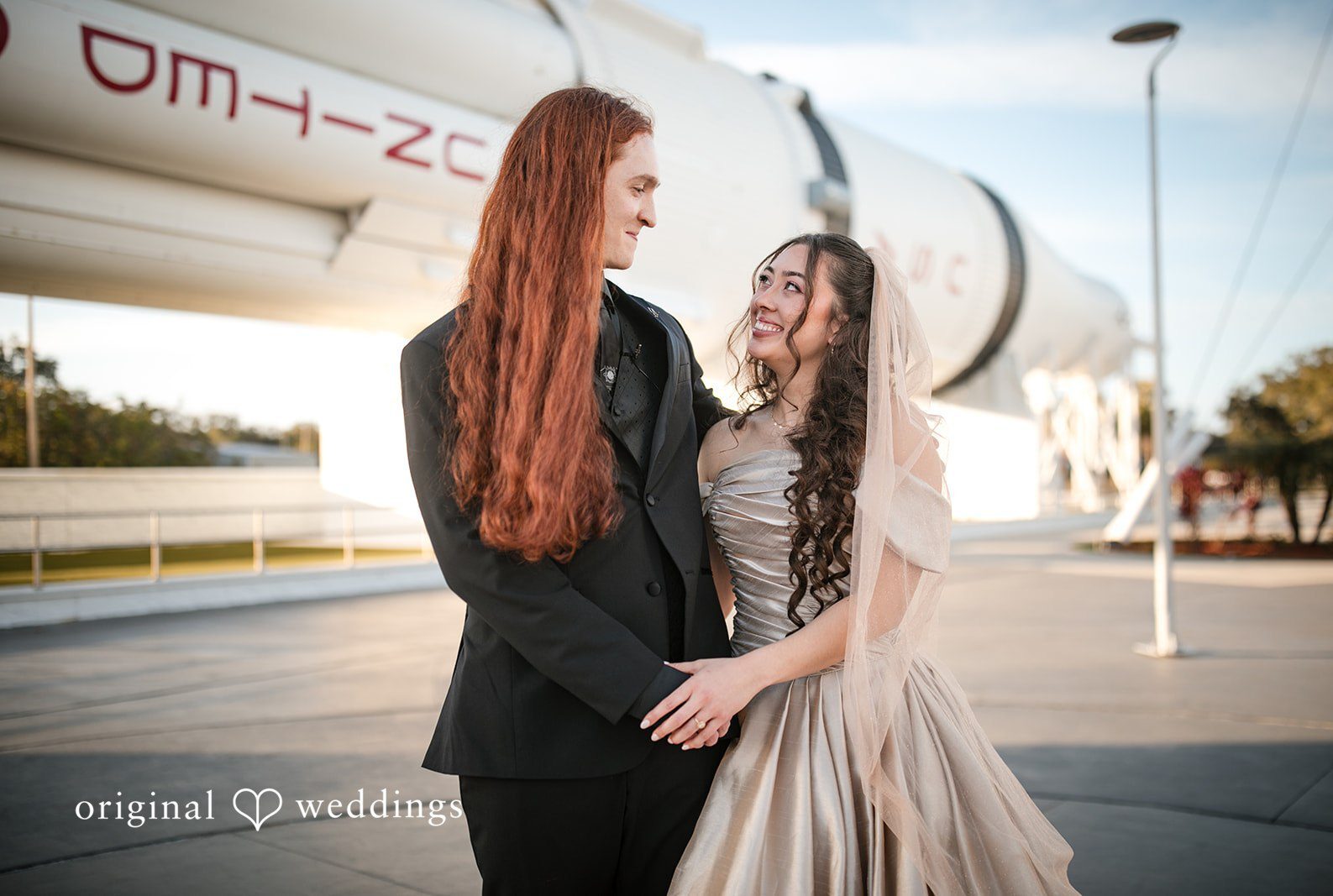 Romantic picture of couple together at Kennedy Space Center photographed by Orlando wedding photographer from Original Weddings