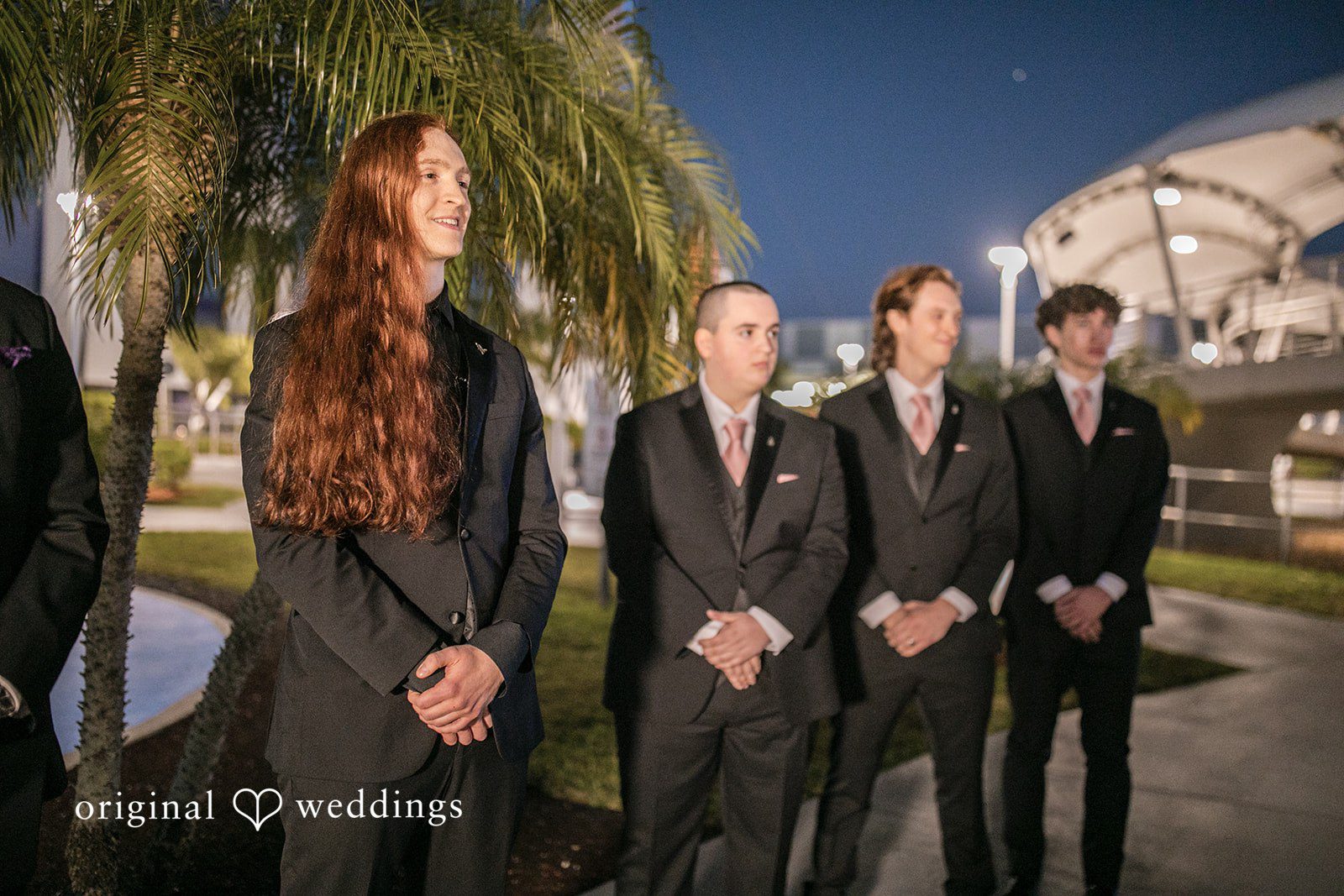 Emotional pre-ceremony moment of groom and groomsmen waiting for the bride