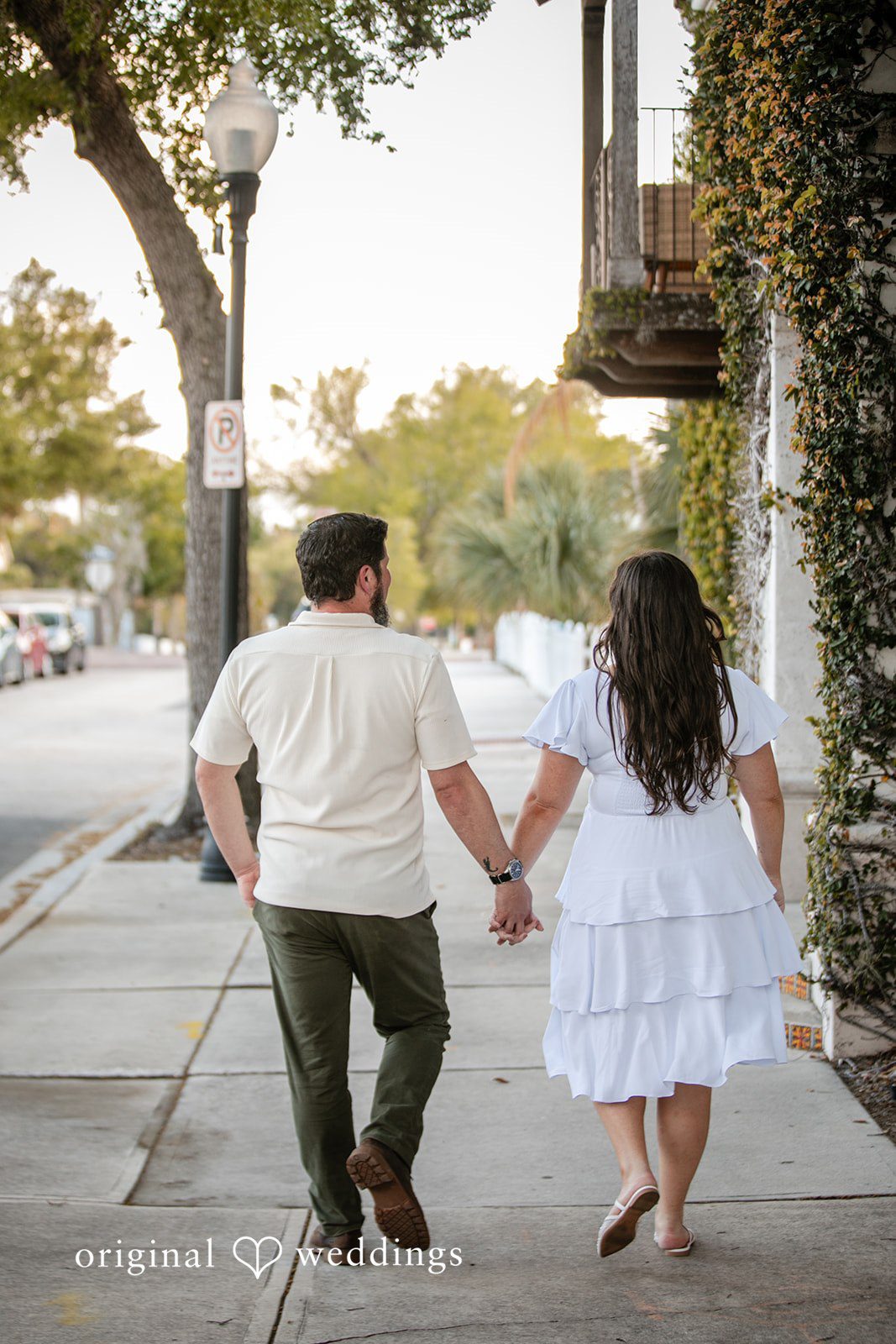 A back view portrait of the couple taking a walk