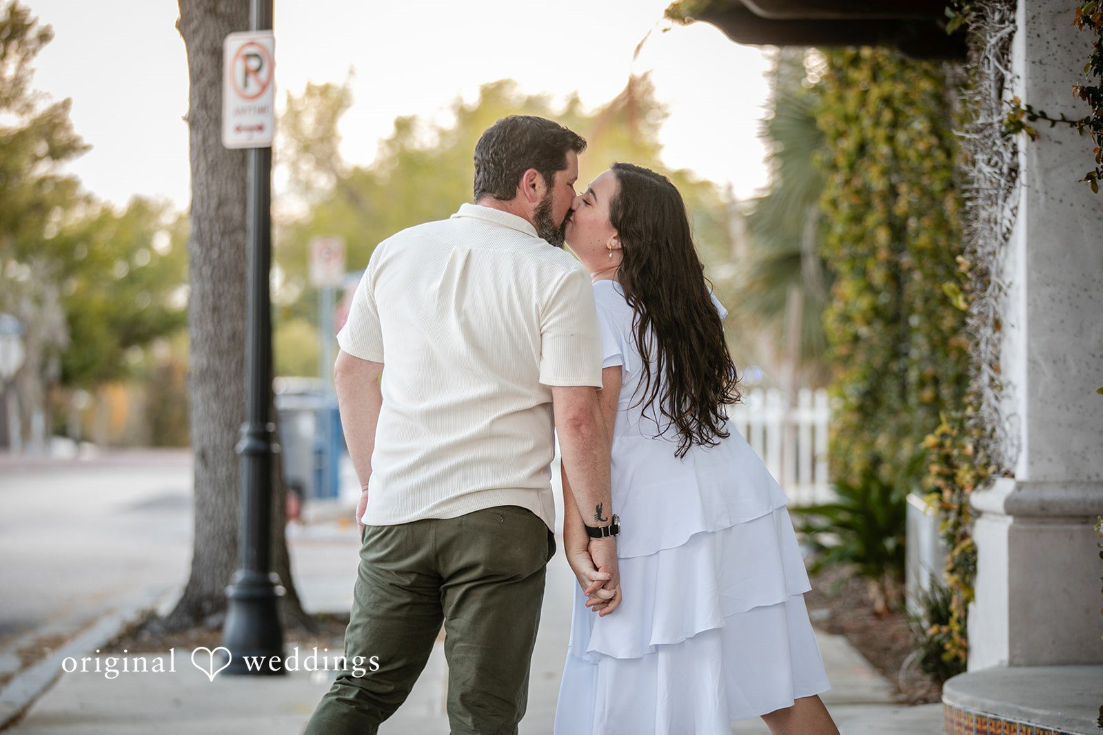 The couple shares a romantic kiss