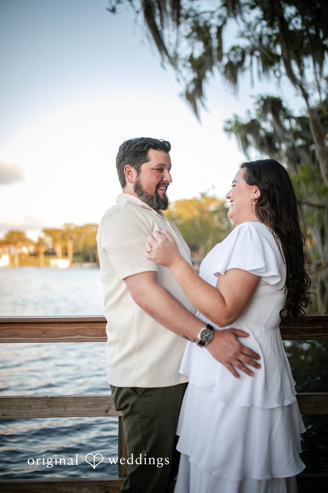 A fun portrait of the couple by the lake