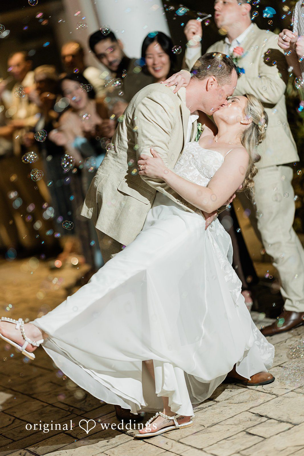 Ethan + Sydney Couple celebrating on dance floor with joyful movement.