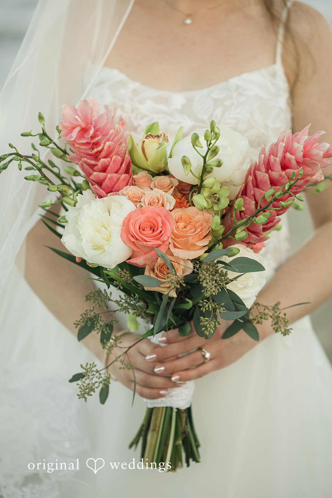 Ethan + Sydney Bride holding bouquet close-up.