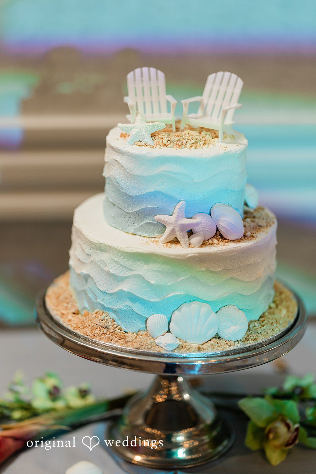 Ethan + Sydney Beach-themed wedding cake with seashell details.
