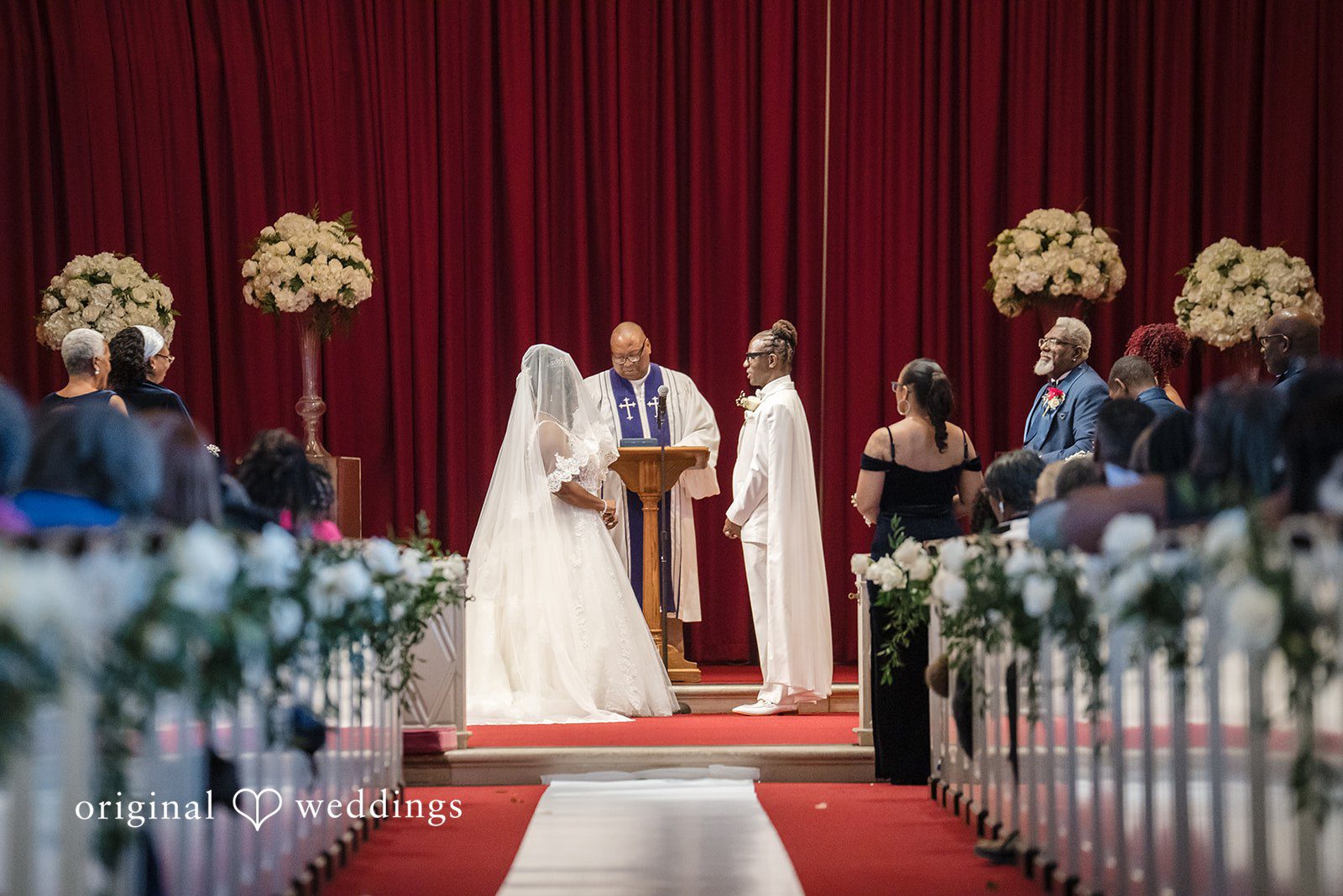 Kimberly + Phillip The bride and groom about to exchange marital vows