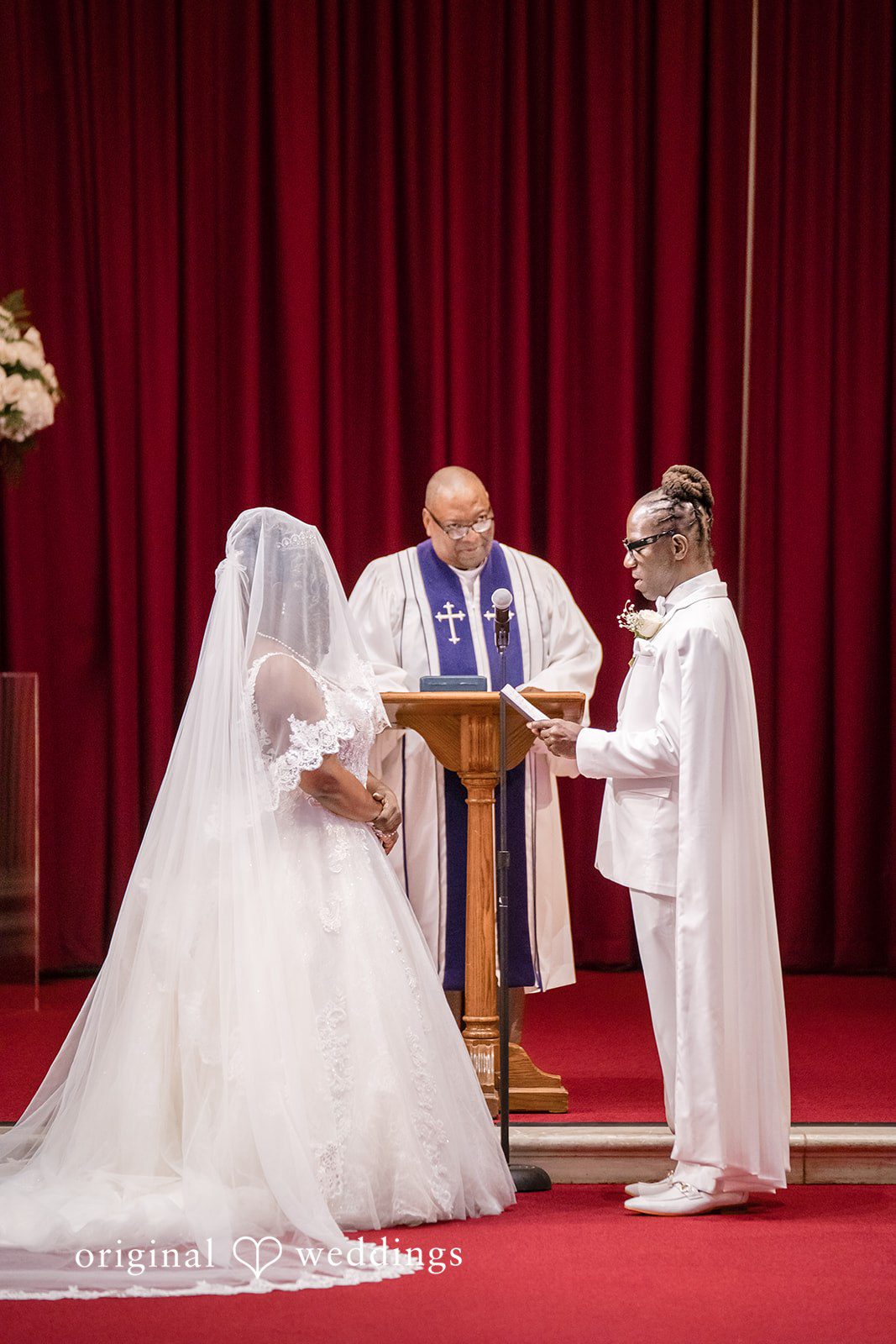 Kimberly + Phillip The groom reads his vows to the bride