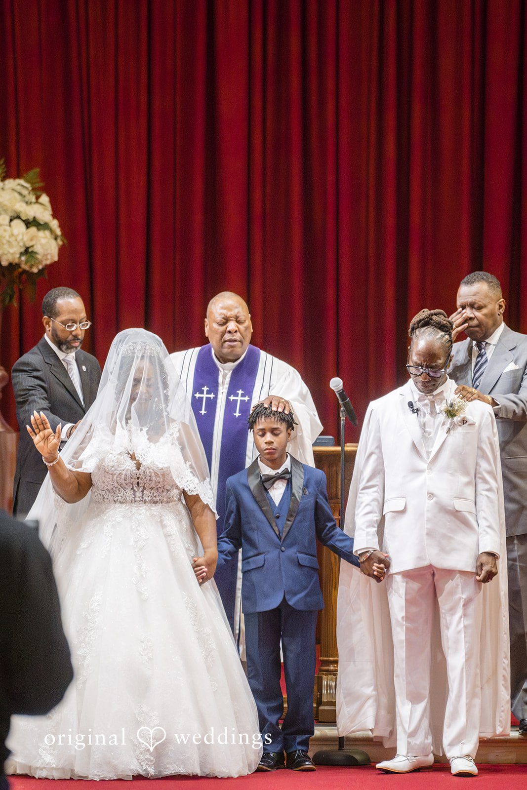 Kimberly + Phillip The priest blesses the union