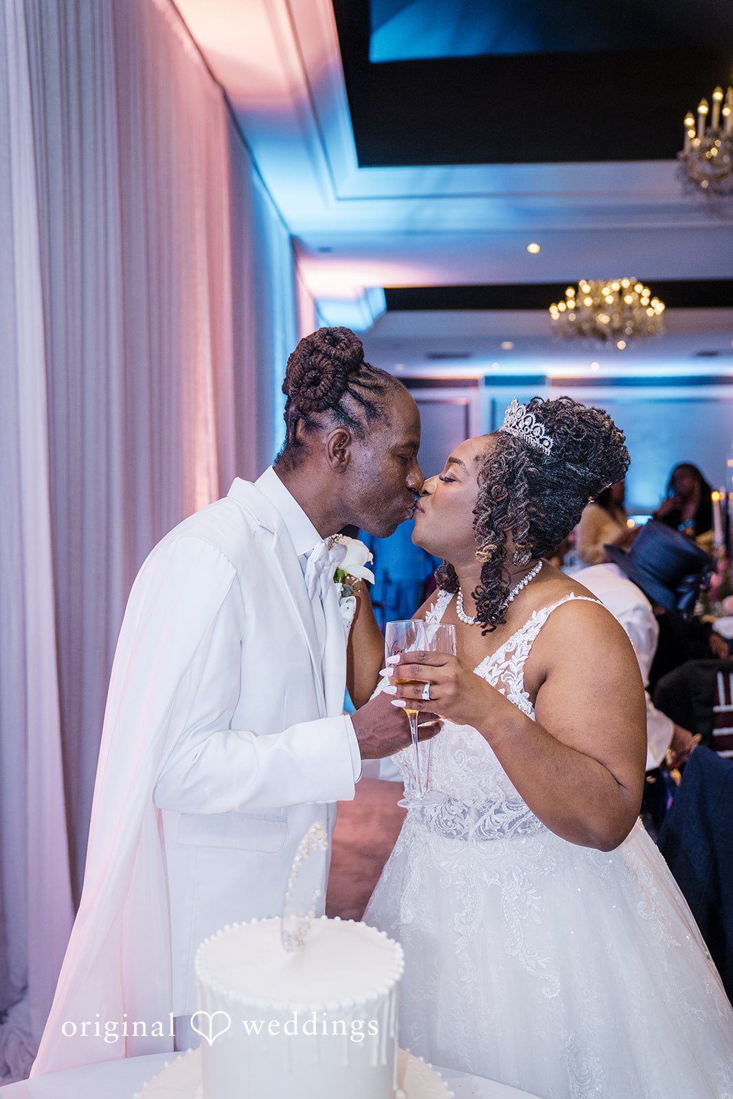 Kimberly + Phillip The couple shares a kiss at their wedding reception