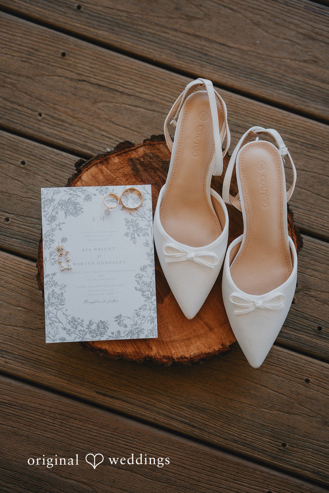 Our Tampa wedding photographers took a detail shot of the bride’s wedding shoes, wedding rings, and wedding IV