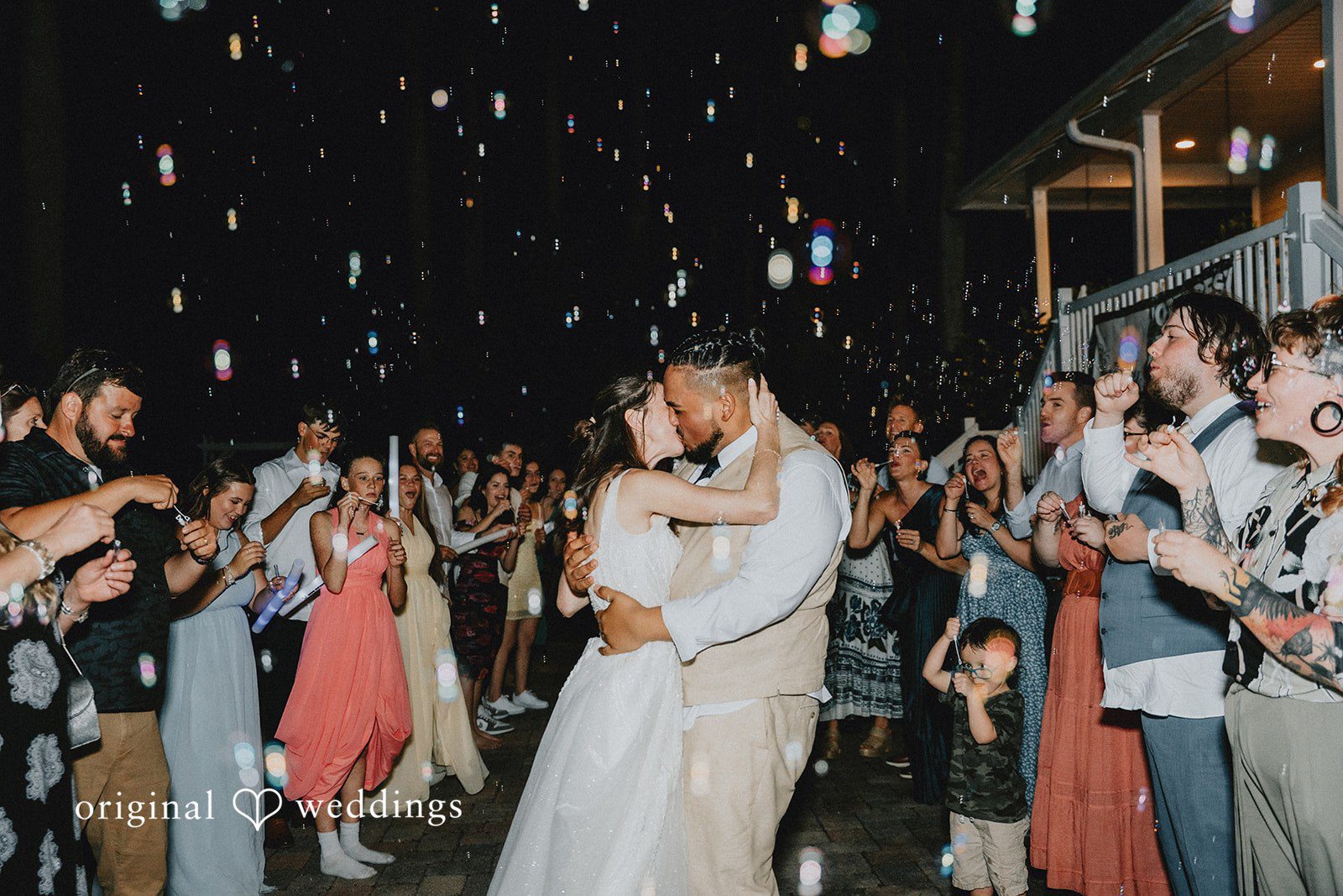 The couple seals the night with a kiss