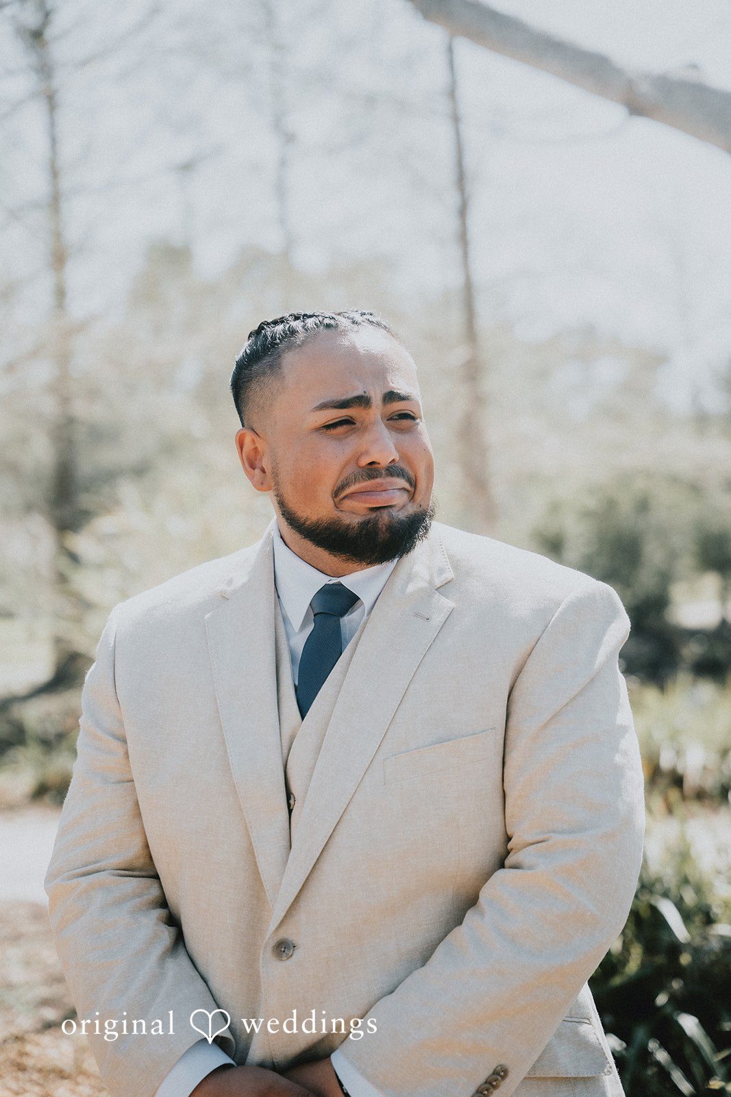 An emotional moment for the groom as the bride walks down the aisle