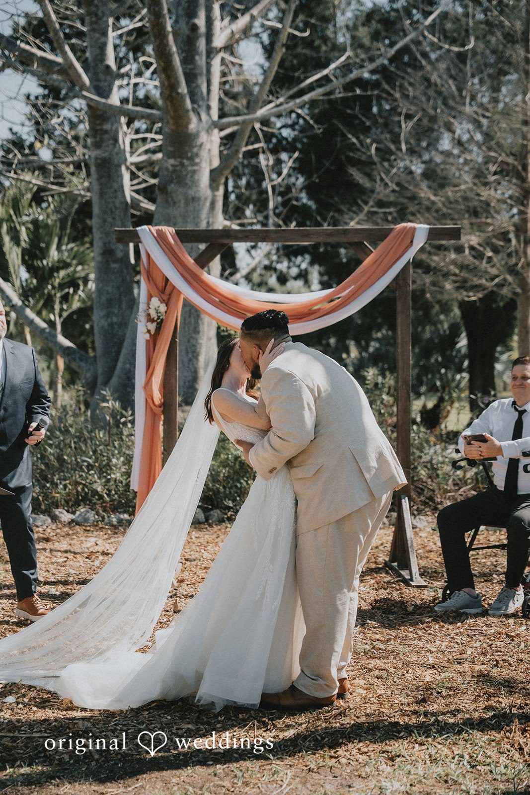 The couple seals their union with a kiss