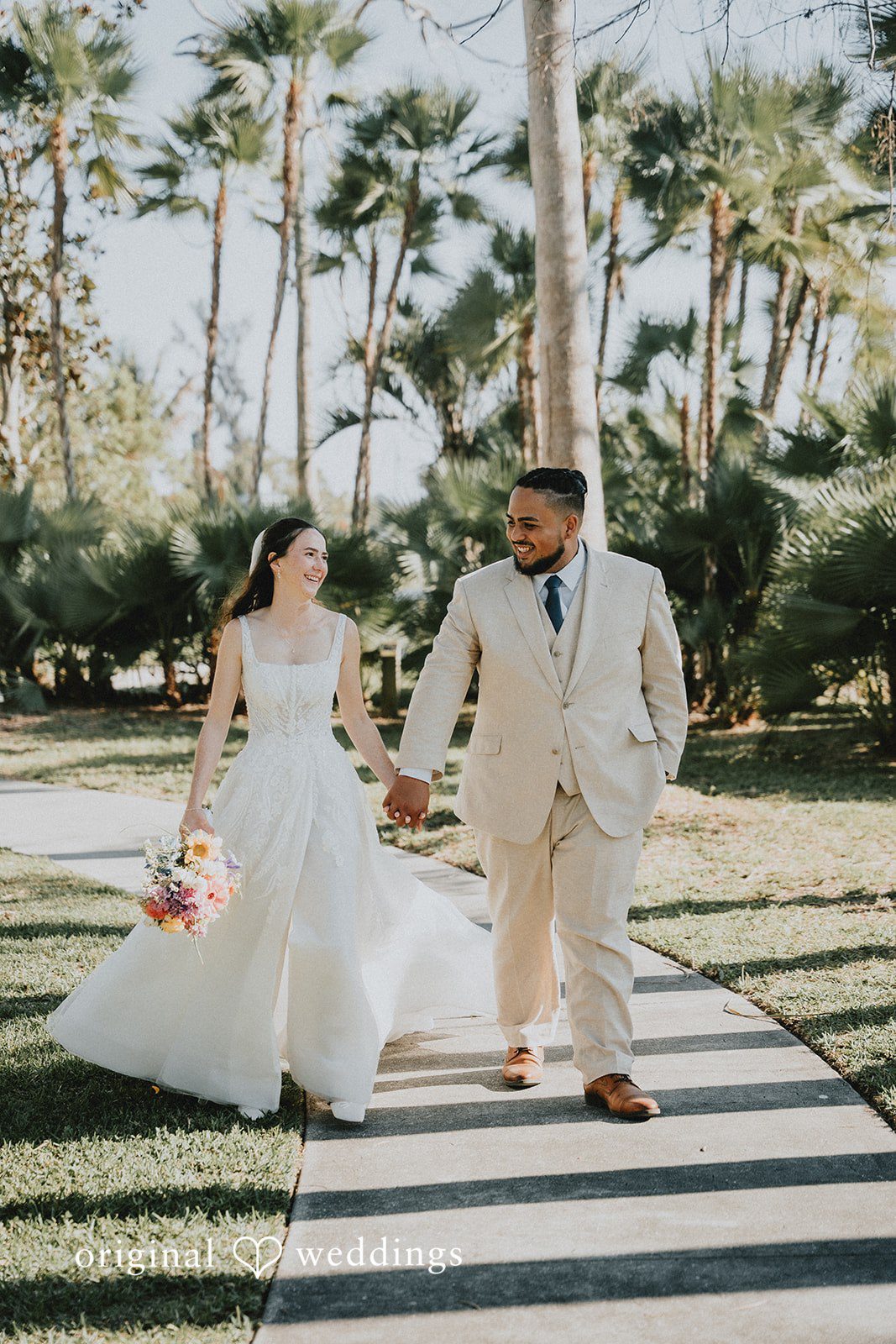 The couple takes a walk through the Palma Sola Botanical Park