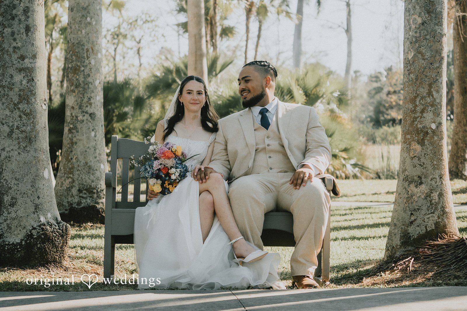 Our Tampa wedding photographers at Original Weddings captured a stunning portrait of the couple at the Palma Sola Botanical Park outdoor space