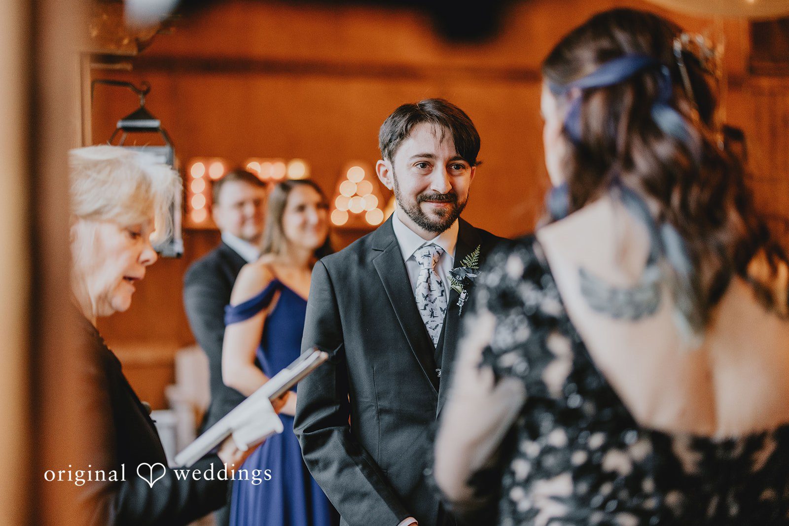 Rows of empty chairs beneath wooden beams show the ceremony space before guests arrive.