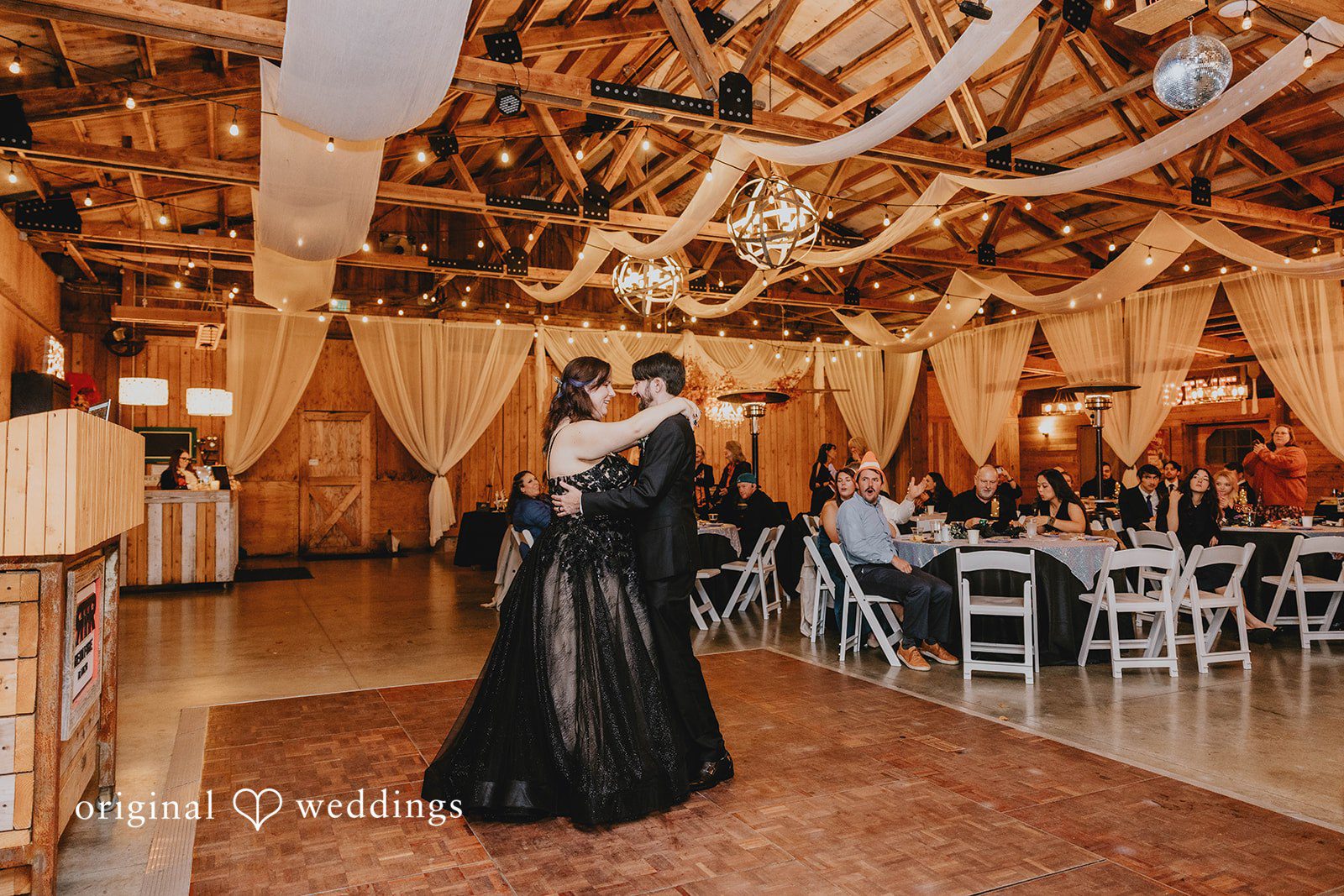 A full-length outdoor portrait emphasizes the flowing fabric and natural setting.