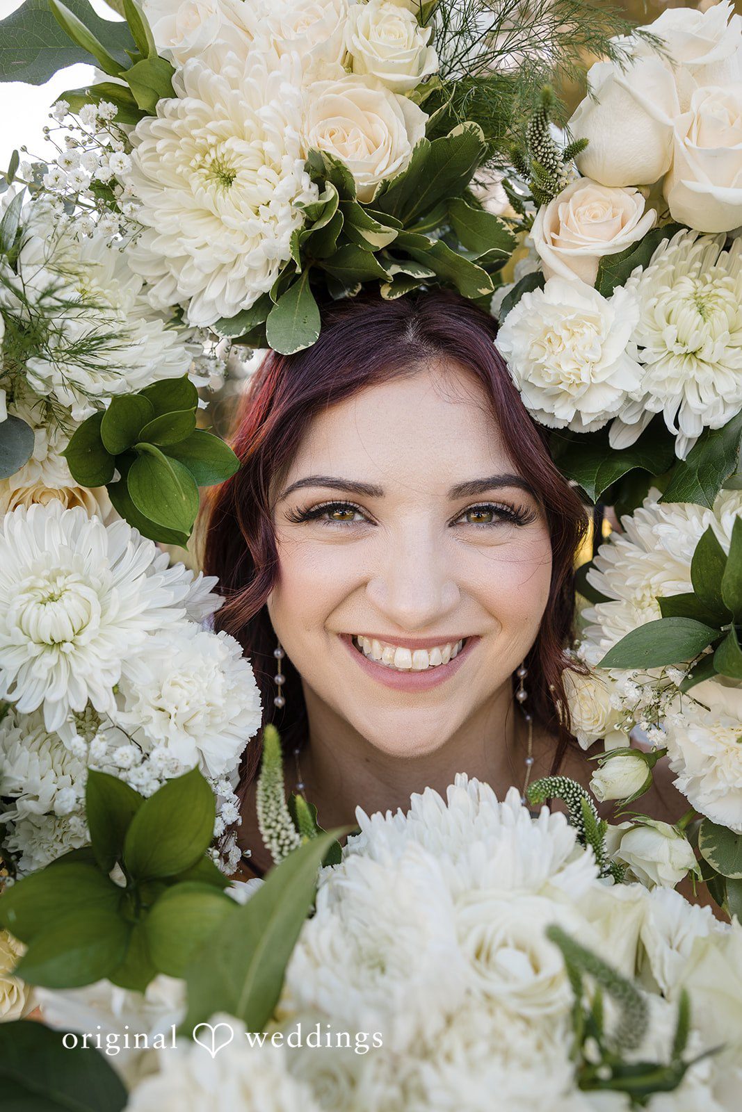 A stylish portrait of the bride rounded by fresh blooms