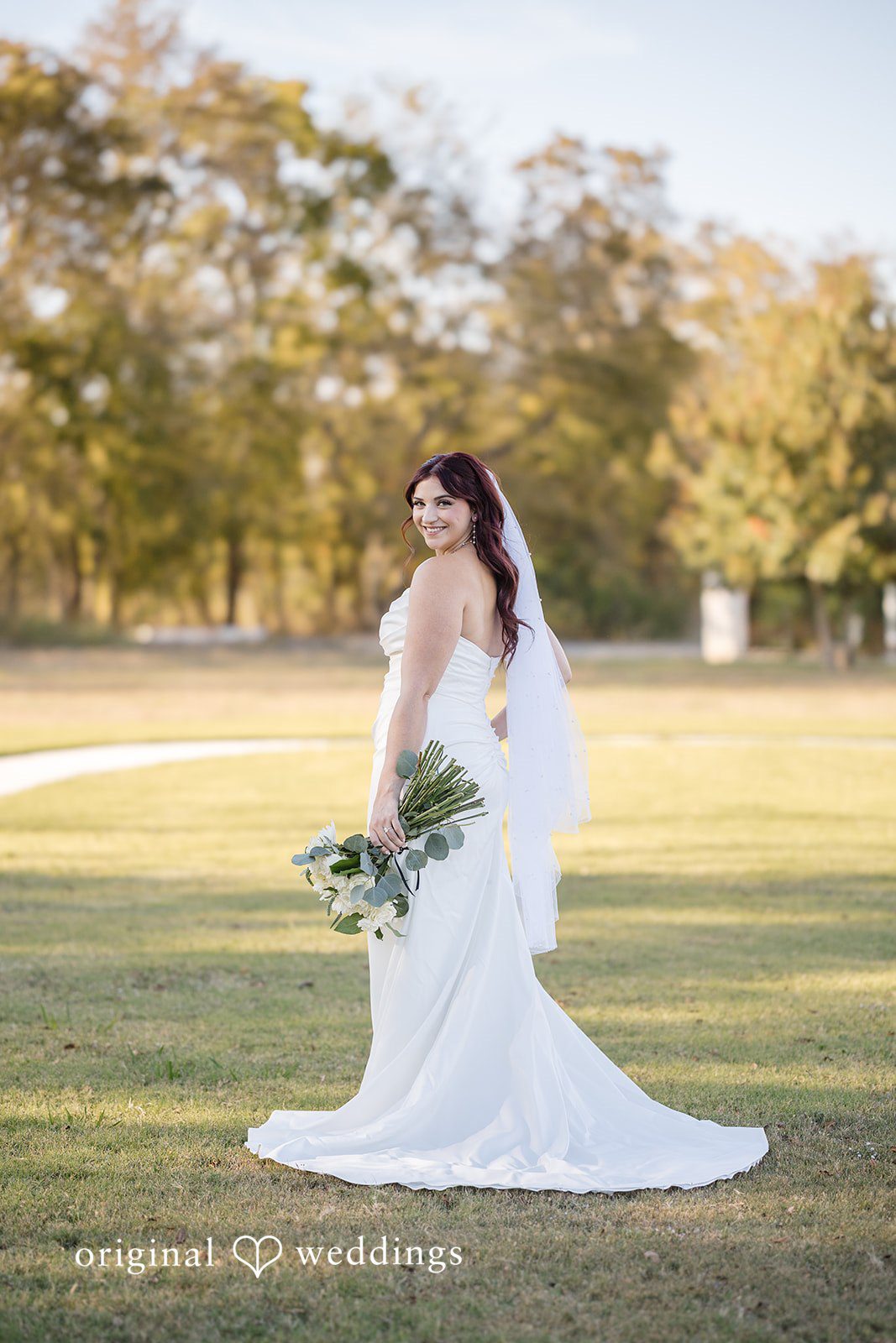 Our Dallas wedding photographer took a gorgeous portrait of the bride in the outdoor area of the River Road wedding venue