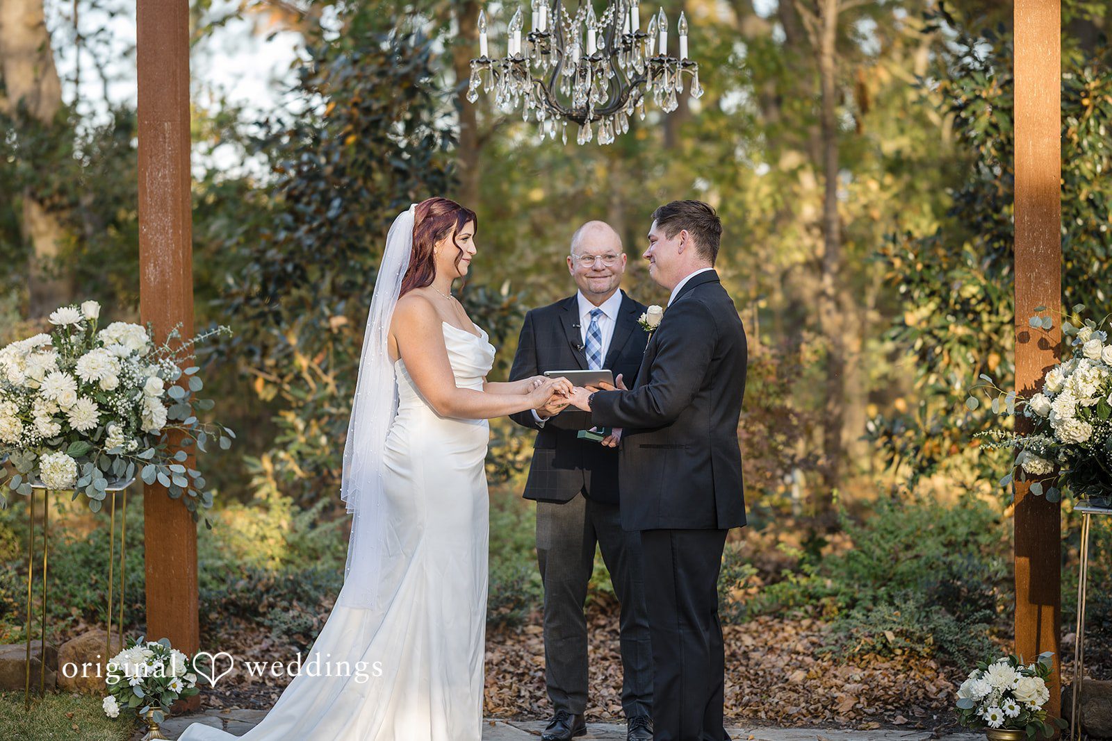 A beautiful portrait of the bride and groom about to exchange wedding rings