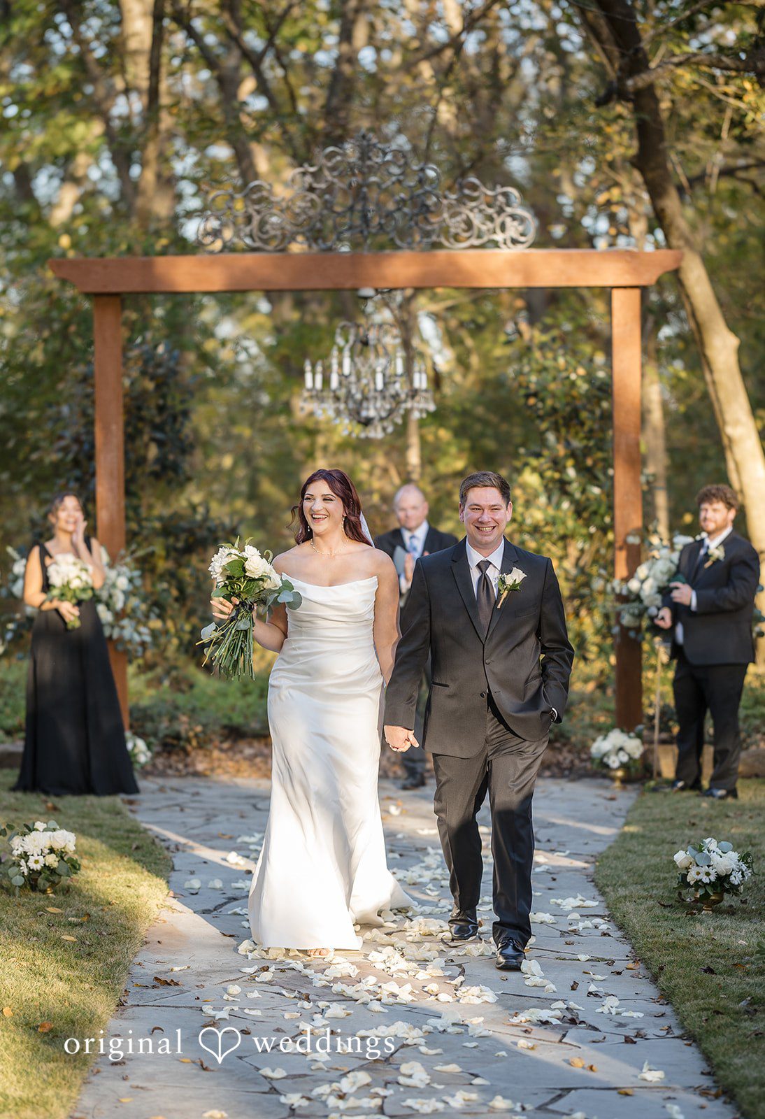 A joyful exit of the couple after their wedding ceremony