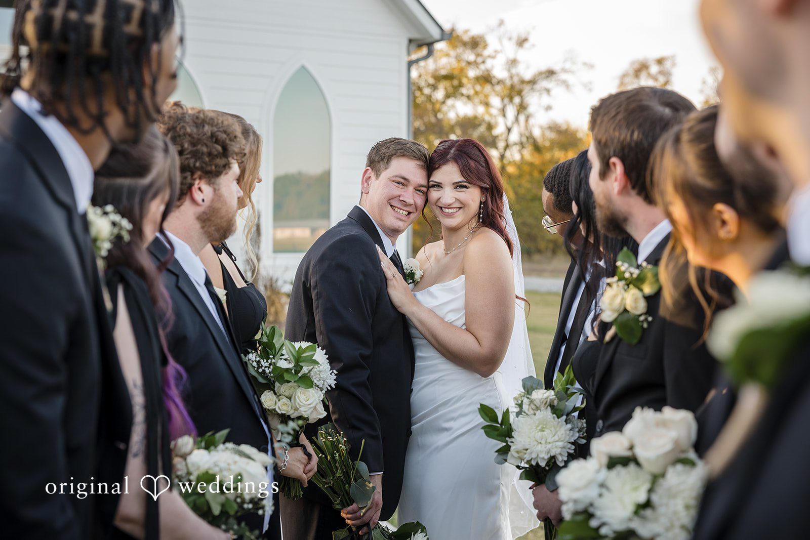 A stylish and beautiful portrait of the couple surrounded by their bridal party