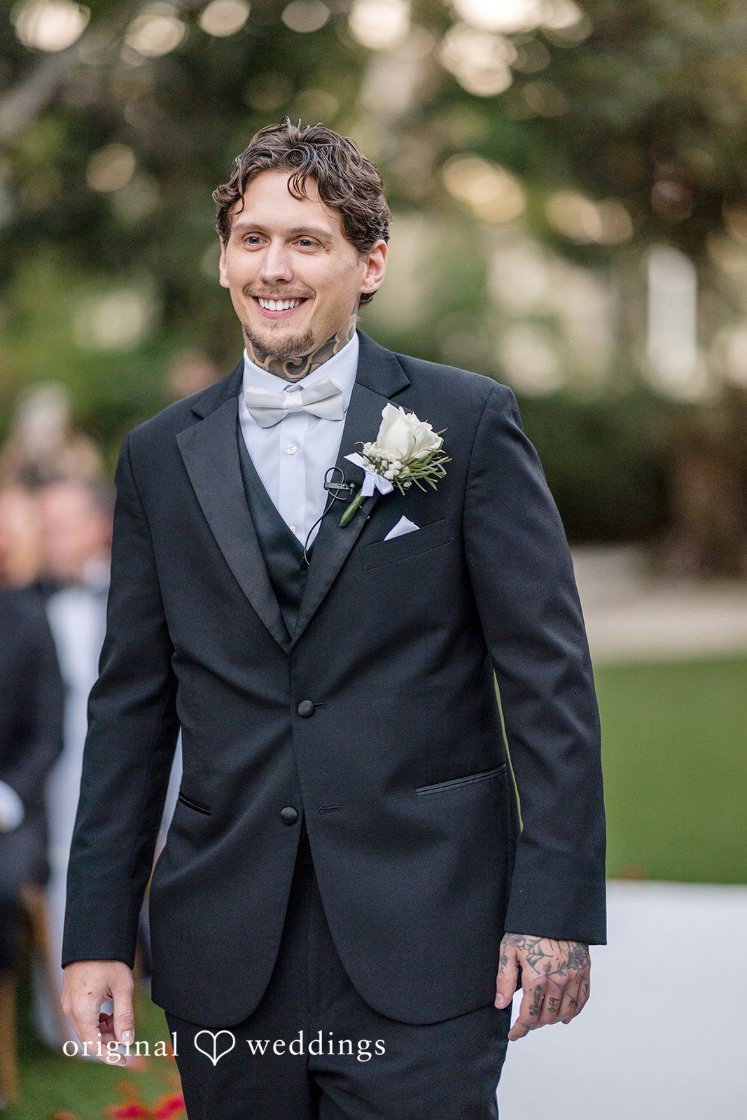 Elegant groom portrait with boutonniere during the wedding day