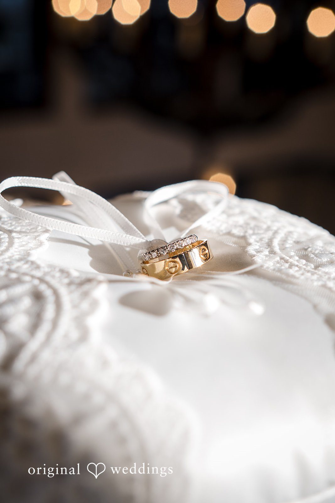 Close-up of wedding rings resting on fabric, a classic Miami Wedding Photography detail