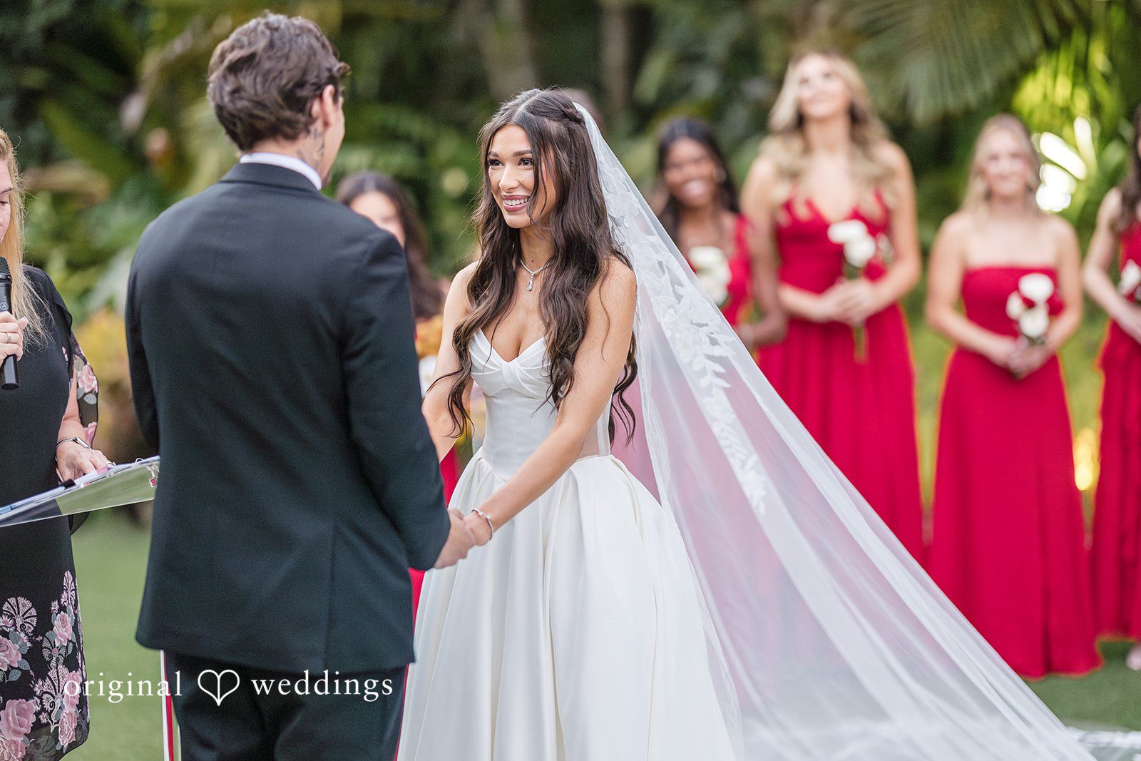 Wedding party portrait with attendants gathered outdoors