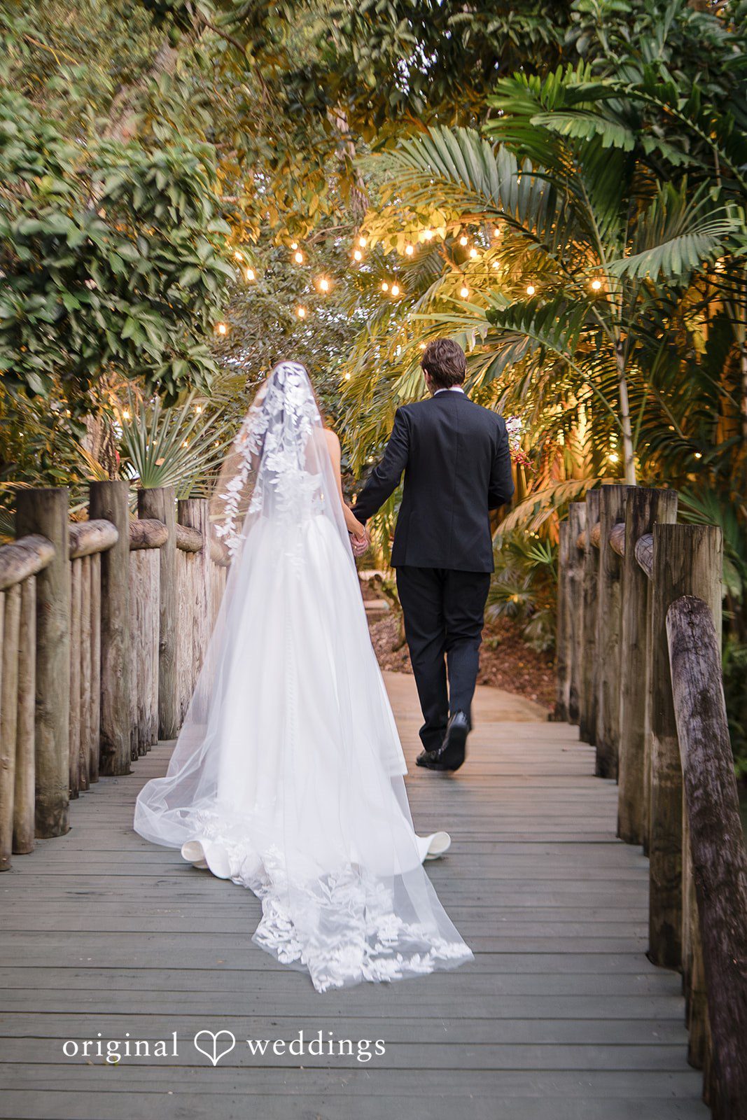 Couple walking hand in hand outdoors in the evening