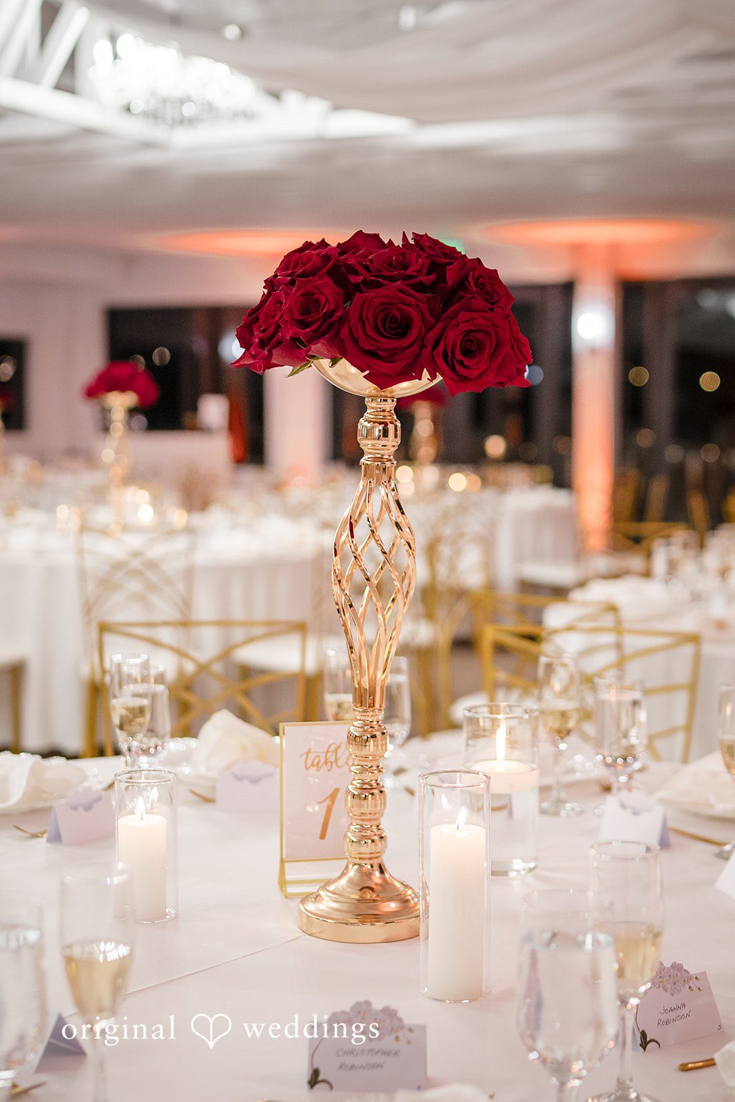 Wedding reception table decor with candlelight and roses photographed for Miami Wedding Photography