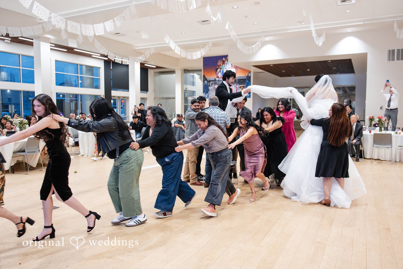 Couple enjoying wedding celebration at Sea Mar Museum of Chicano/a/Latino/a Culture