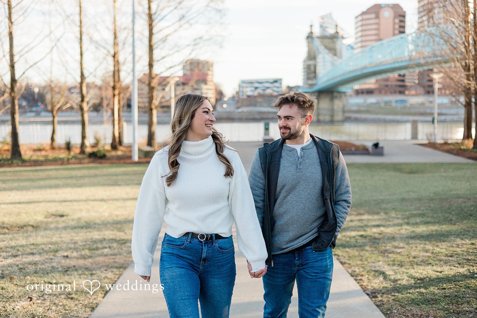 Lovely picture of couple walking hands in hands in Smale Riverfront Park