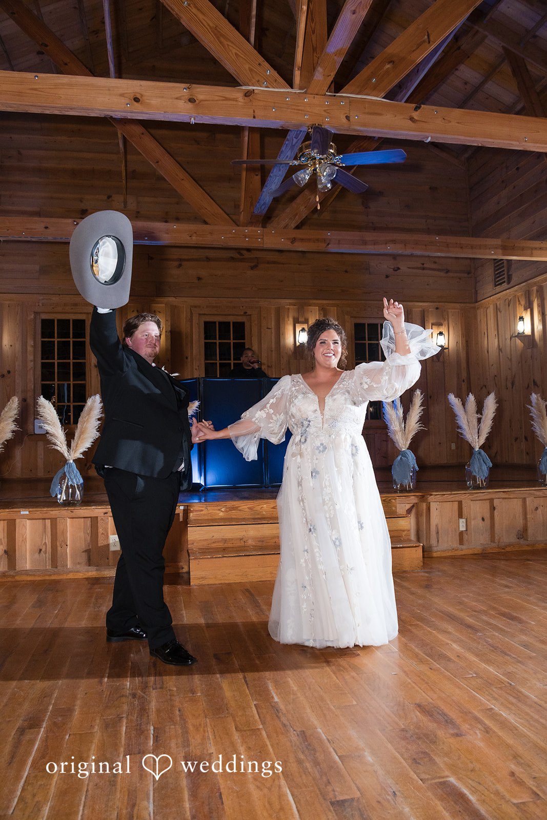Kelsey + Riley The couple spins and laughs while dancing energetically together.