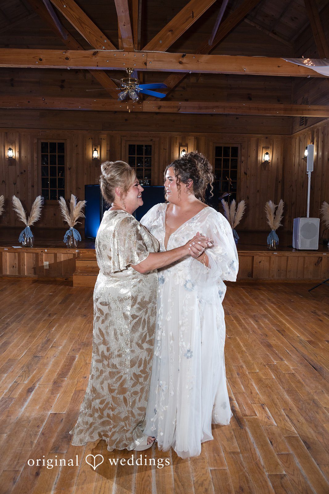 Kelsey + Riley The bride dances joyfully with a family member during the celebration.