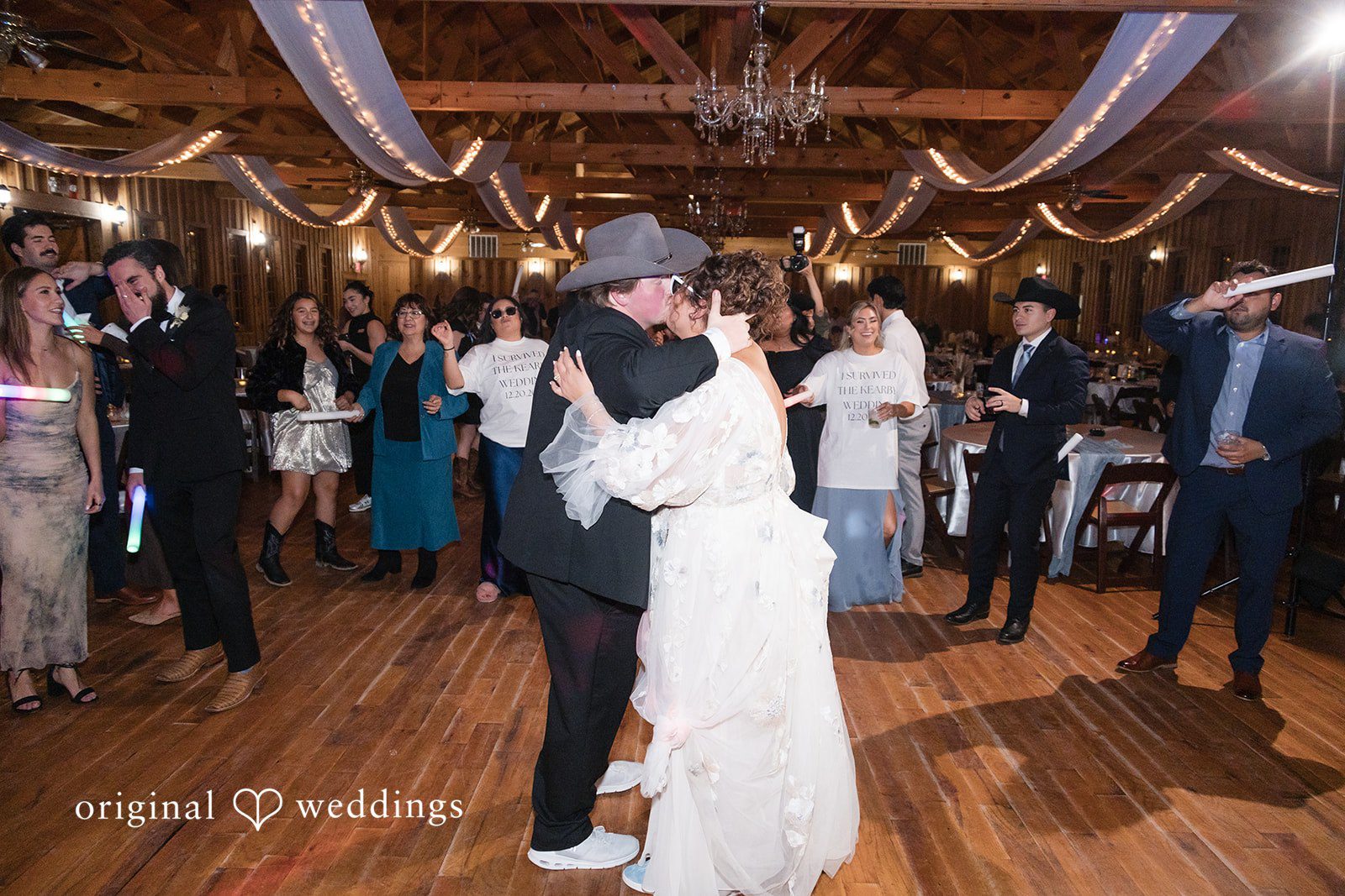 Kelsey + Riley The couple shares their first dance surrounded by cheering guests.