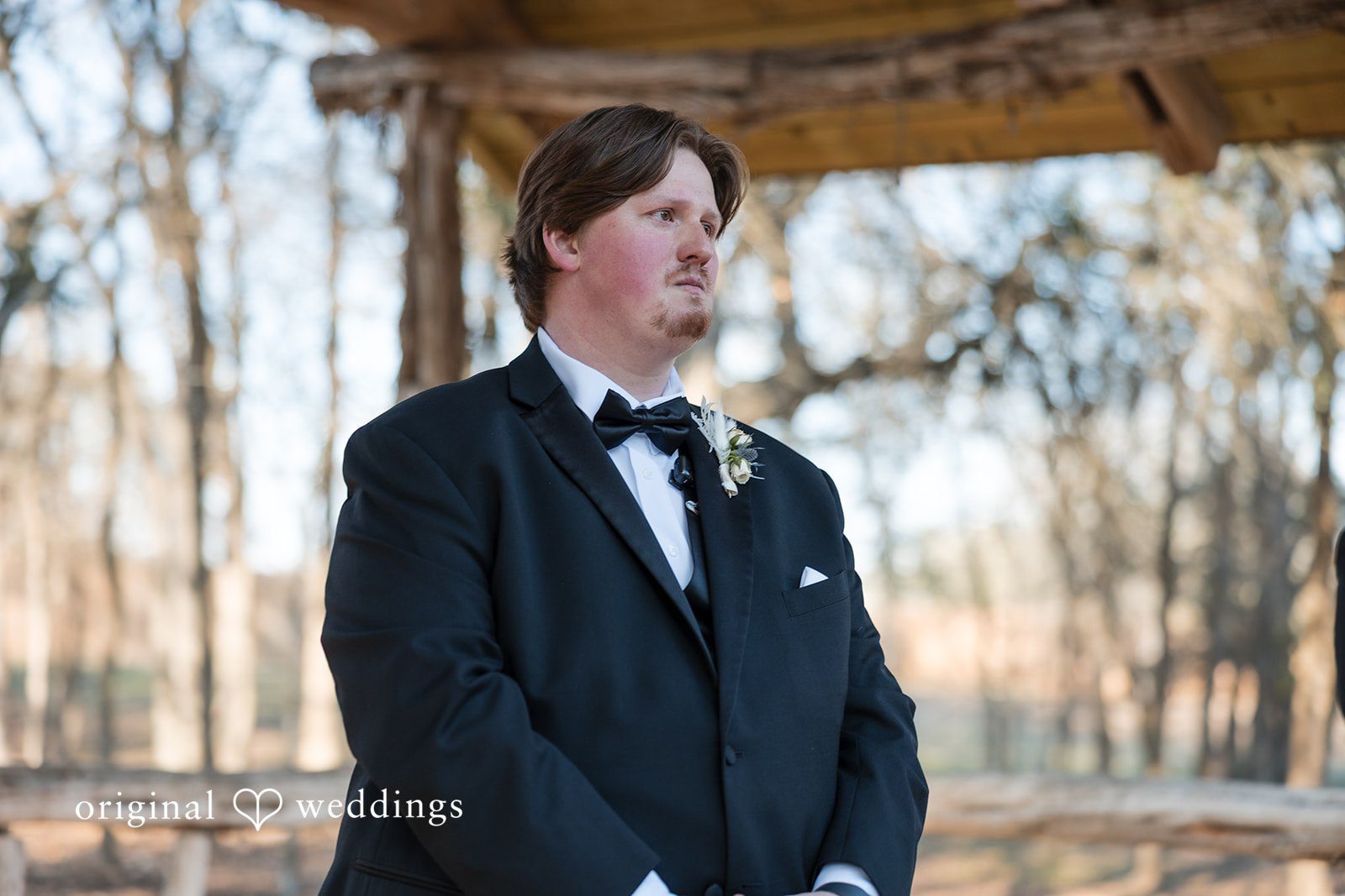 Kelsey + Riley A portrait of the groom captures him looking thoughtful.