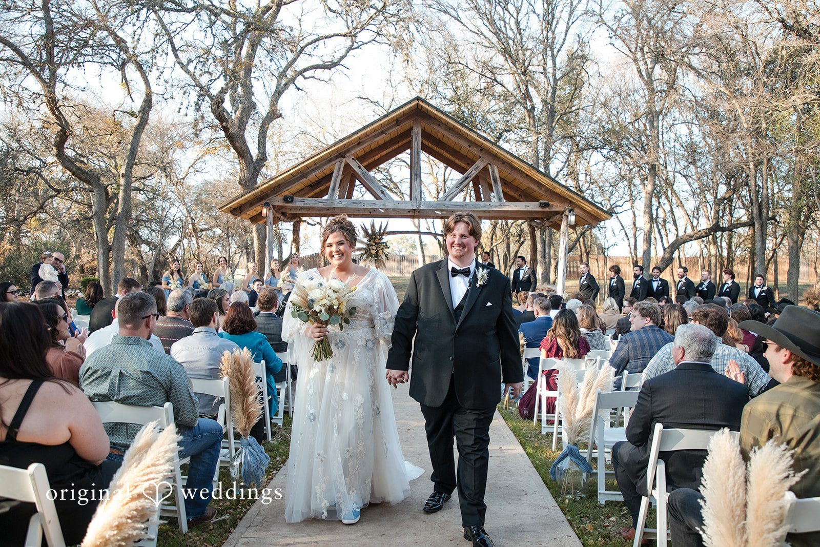 Kelsey + Riley The couple walks down the aisle together after the ceremony.