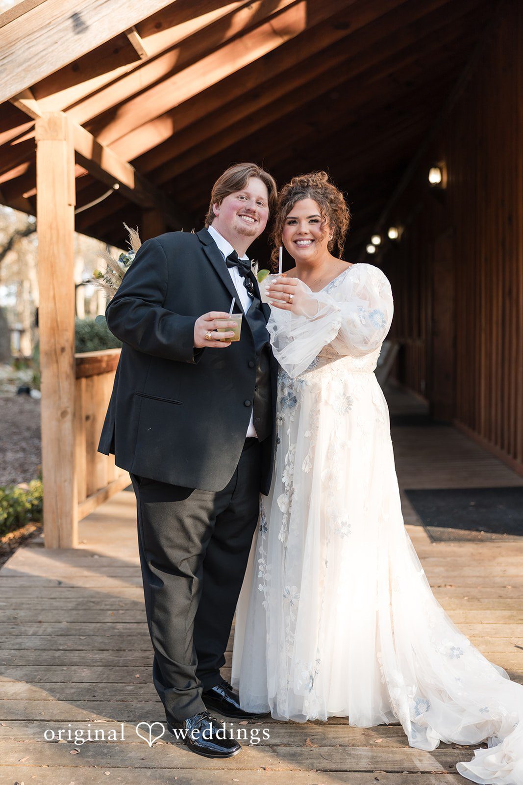 Kelsey + Riley The couple shares a joyful moment together outside the venue.