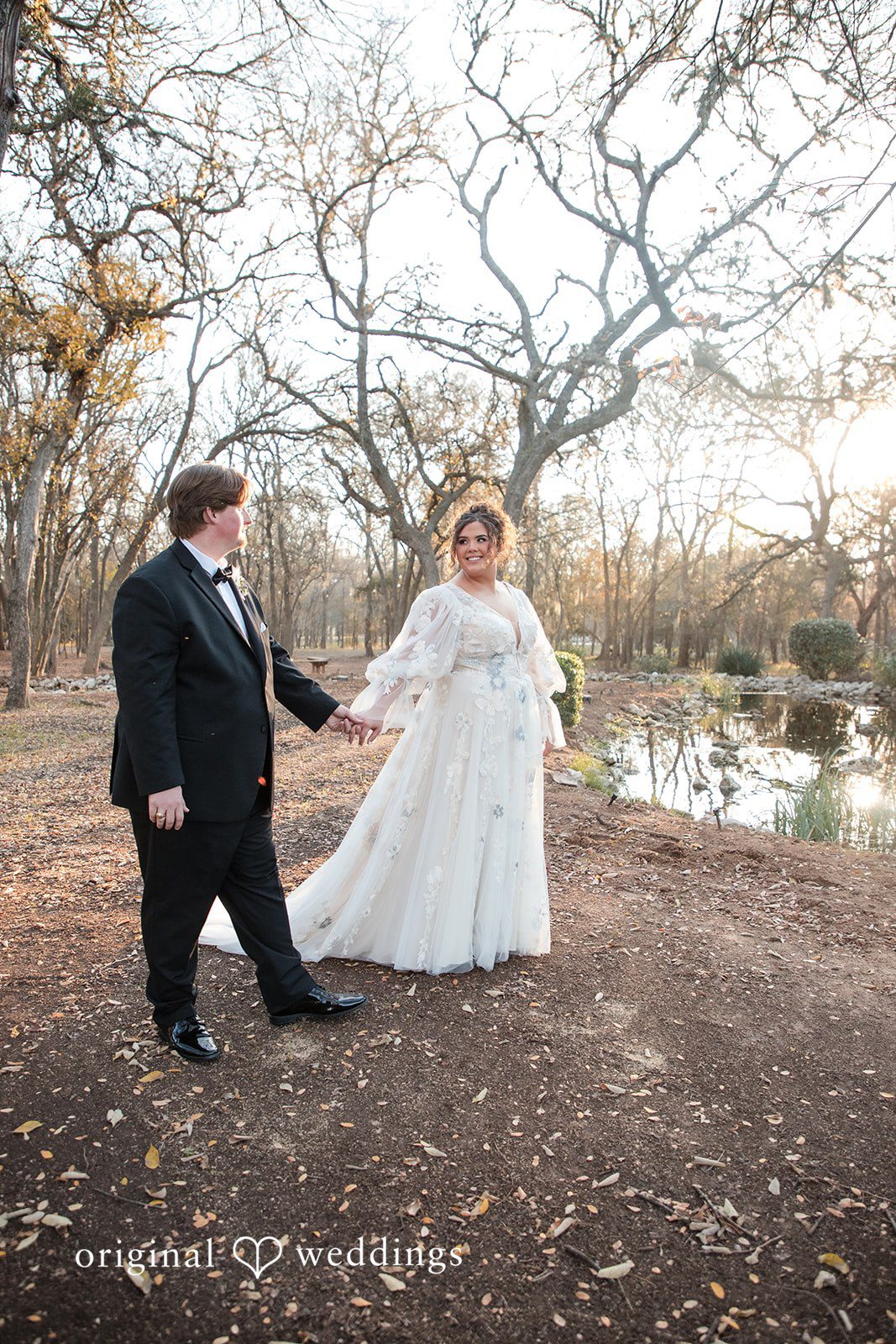 Kelsey + Riley The couple walks together outdoors, sharing a joyful moment.