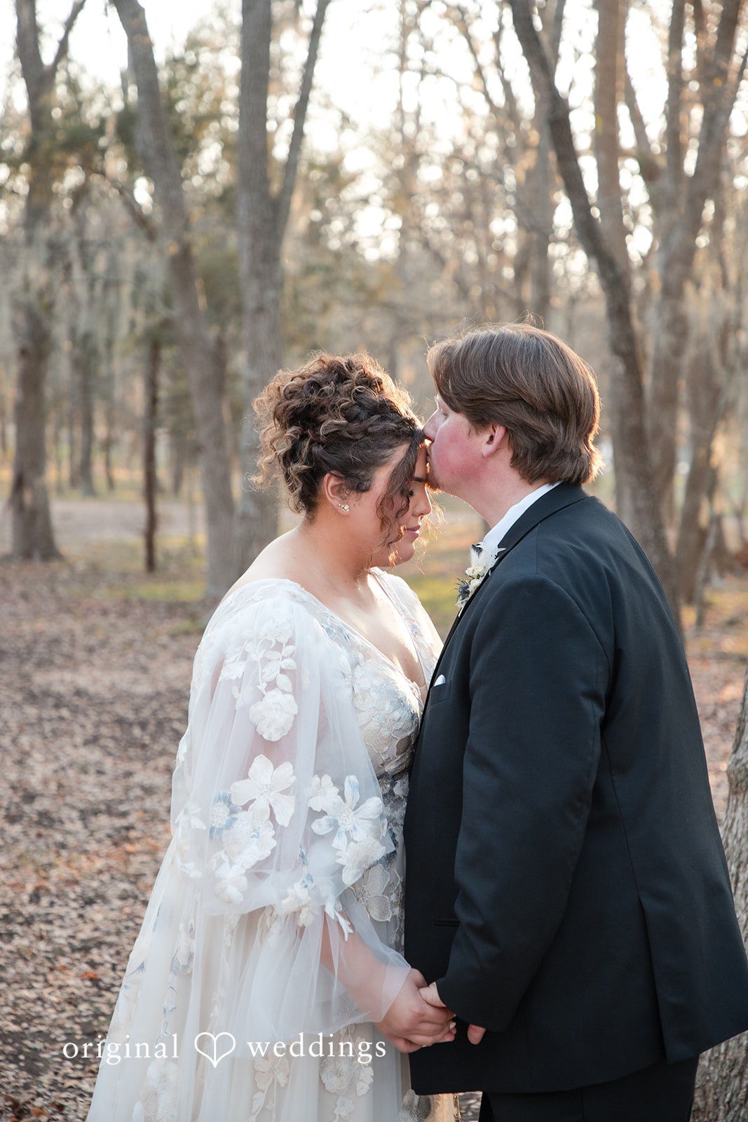 Kelsey + Riley The couple leans in close, sharing an intimate moment outdoors.