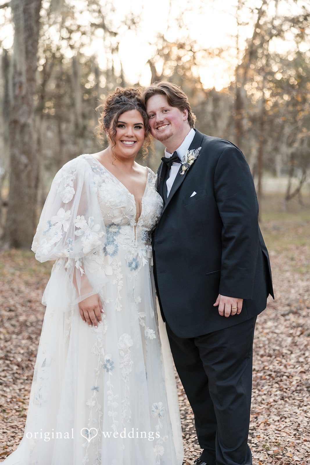 Kelsey + Riley The newlyweds pose together smiling after their ceremony.