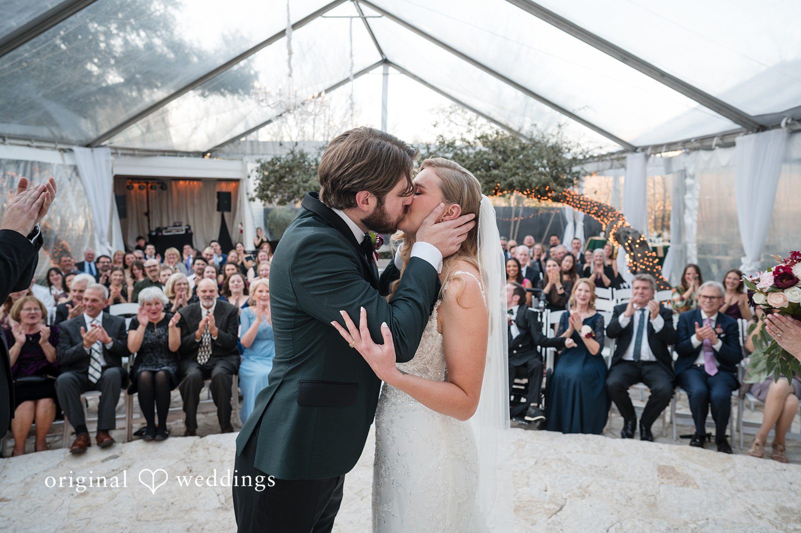 Our Austin wedding photographers at Original Weddings captured the romantic moment when the couple shared a kiss at their Allan House wedding ceremony