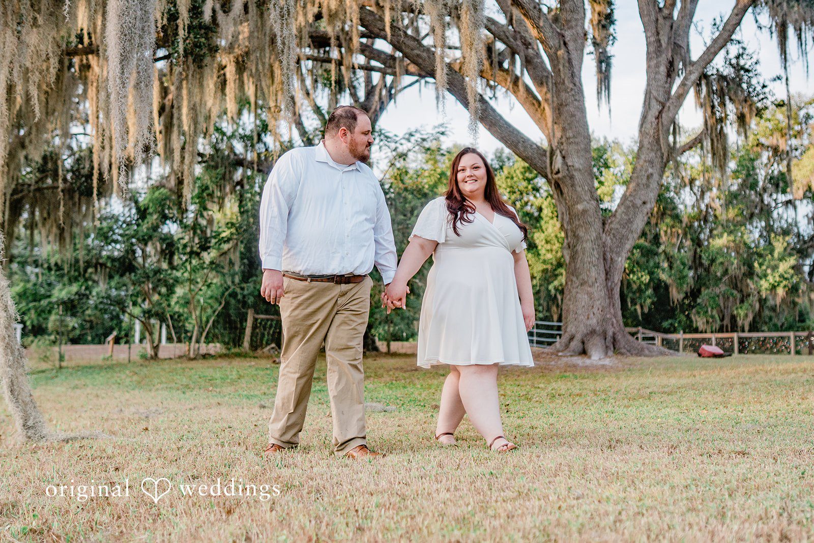 Beautiful couple walking and holding hands picture at The Barn at Crescent Lake in Odessa